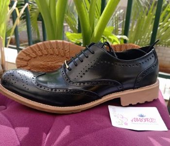 Black brogue with brown sole