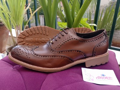 Dark brown brogue with brown sole