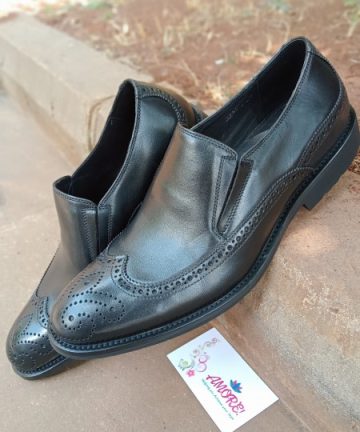 Black brogue slip on