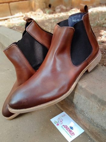 Dark brown chelsea boot with brown sole