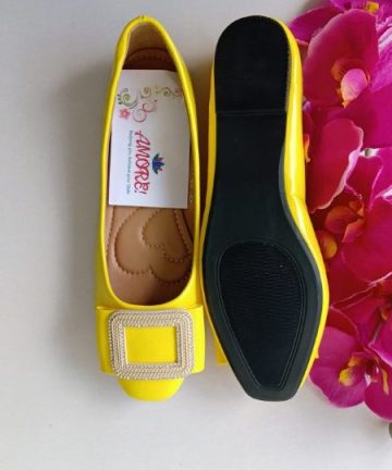 Yellow doll shoe with gold buckle