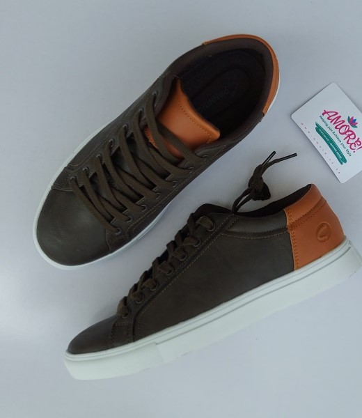 Brown sneaker with white sole and orange edge