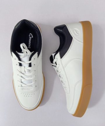 White and black sneaker with brown sole